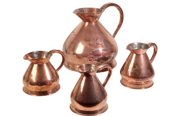 AN ASSOCIATED GROUP OF FOUR VICTORIAN COPPER 'HAYSTACK' WINE MEASURES,