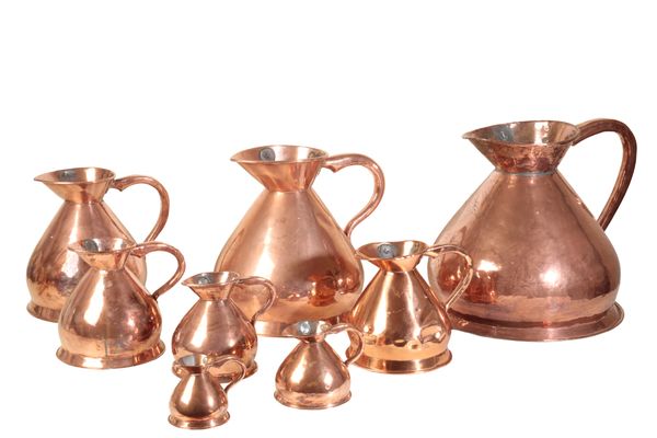 AN ASSOCIATED GROUP OF EIGHT VICTORIAN COPPER 'HAYSTACK' WINE MEASURES,