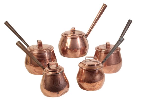 A COMPOSITE SET OF FIVE COPPER BELLIED SAUCEPANS,