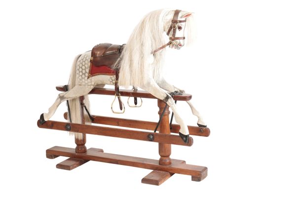 A LATE VICTORIAN OR EDWARDIAN PAINTED WOOD ROCKING HORSE,