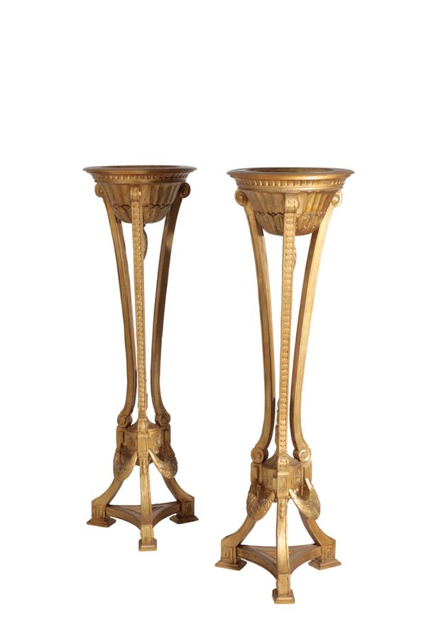 A PAIR OF CARVED AND GOLD PAINTED WOOD JARDINIERE STANDS IN NEOCLASSICAL TASTE,