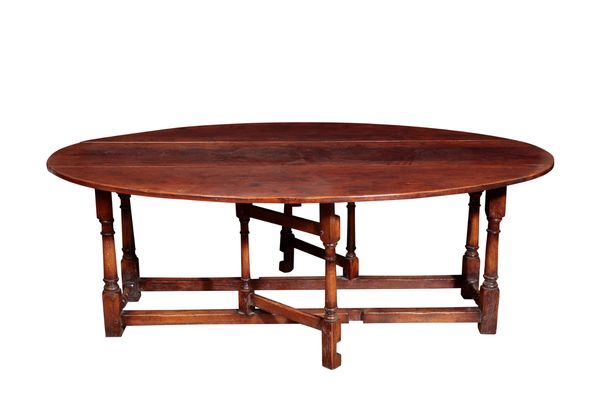 AN OAK GATELEG WAKE TABLE,