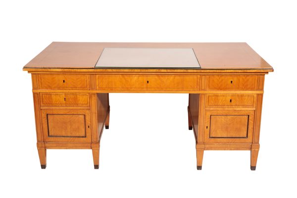 A NORTH EUROPEAN SATINBIRCH DESK IN BIEDERMEIER STYLE,