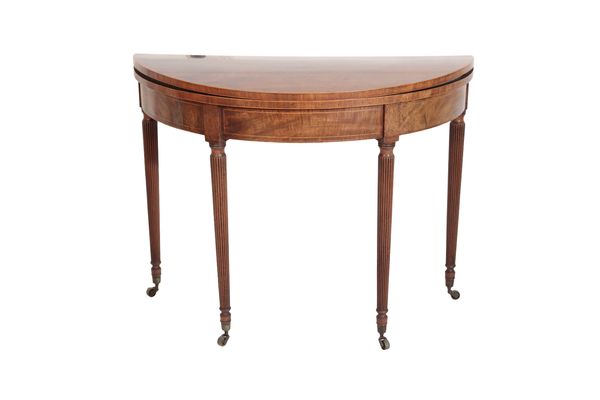 A GEORGE III MAHOGANY AND CROSS BANDED DEMI-LUNE CARD TABLE,