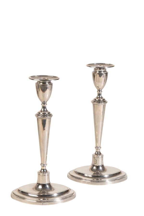 A PAIR OF HALLMARKED SILVER CANDLESTICKS,