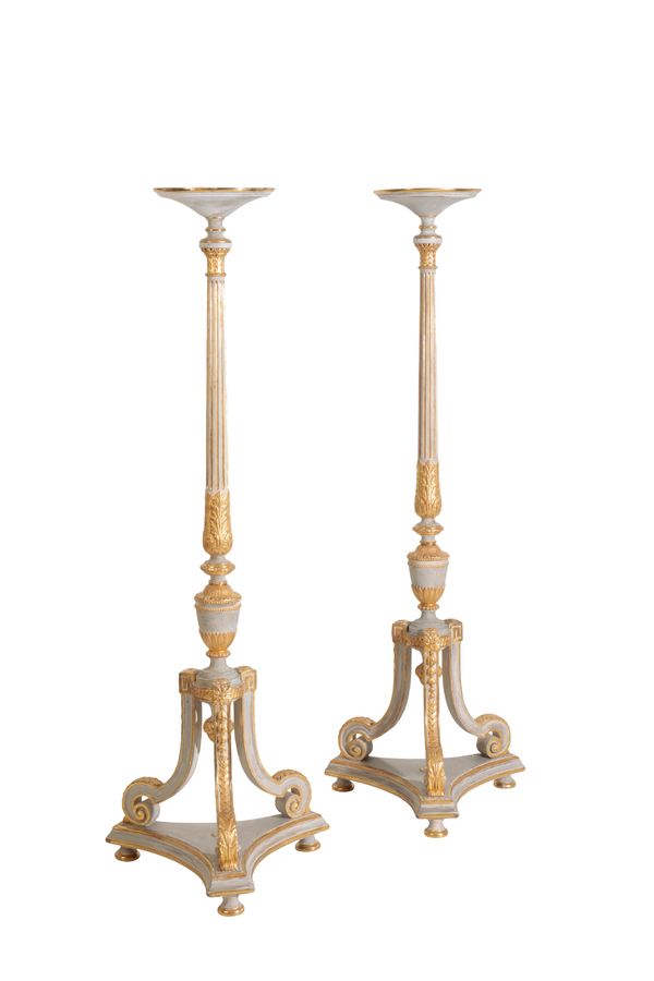 A PAIR OF CARVED AND PARCEL GILTWOOD TORCHERES IN LOUIS XVI TASTE,