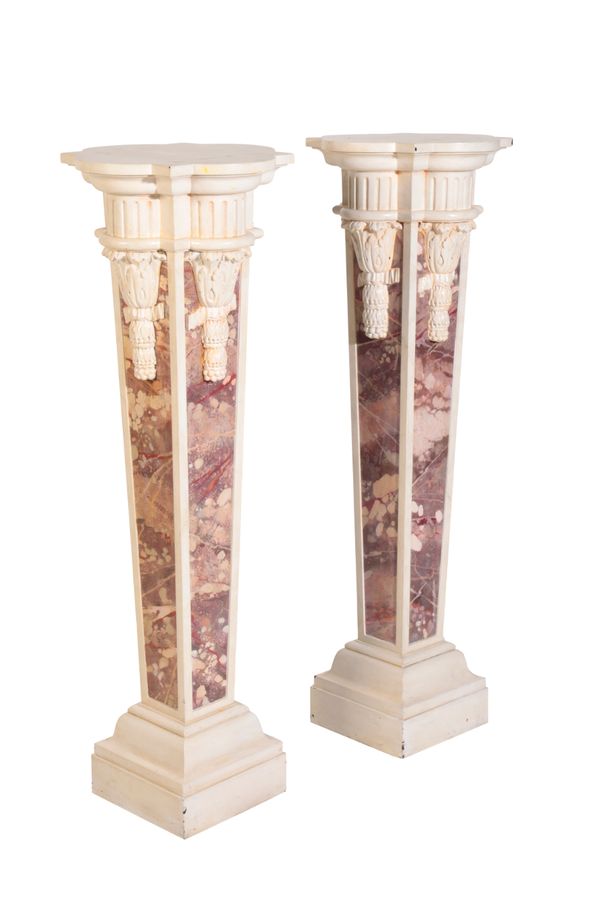 A PAIR OF CARVED AND PAINTED FAUX MARBLE WOOD PEDESTALS,