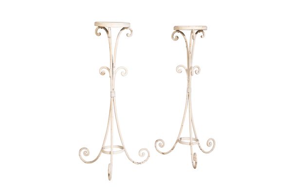 A PAIR OF WHITE PAINTED WOOD AND WROUGHT IRON MOUNTED TRIPOD STANDS,