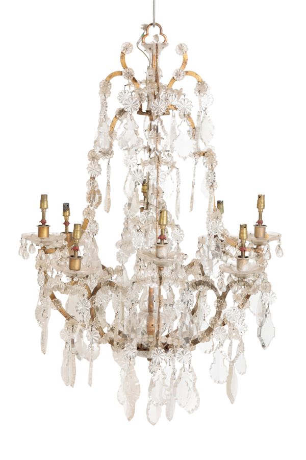 A METAL AND GLASS HUNG EIGHT LIGHT CHANDELIER, IN LOUIS XV STYLE,