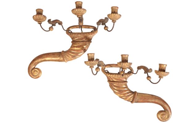 A PAIR OF ITALIAN CARVED AND GILTWOOD THREE LIGHT WALL APPLIQUES,