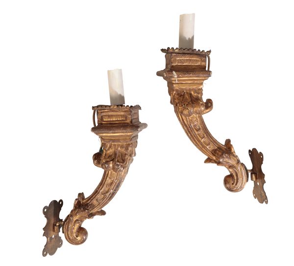 A PAIR OF CONTINENTAL GILT COMPOSITION WALL APPLIQUES MODELLED AS TORCHERES,