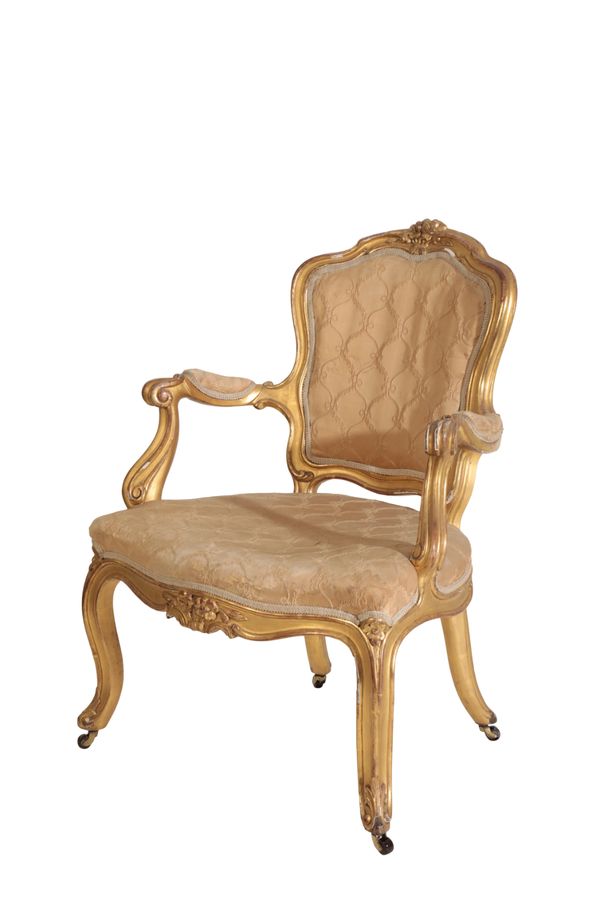 A CARVED AND GILTWOOD FAUTEUIL , IN LOUIS XV STYLE,