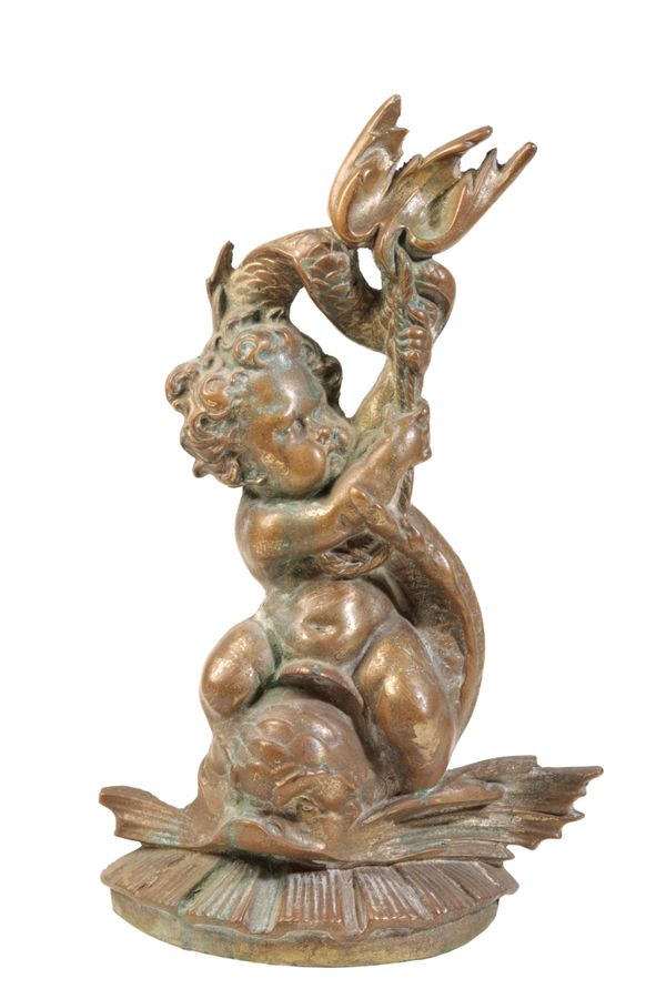 A VICTORIAN BRASS DOOR PORTER CAST AS A PUTTO ON A DOLPHIN,