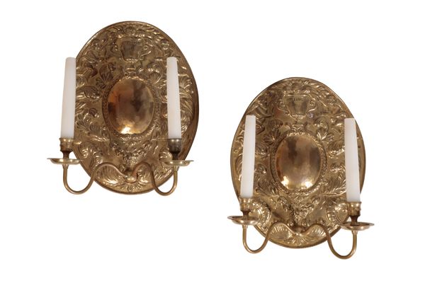 A PAIR OF DUTCH STYLE BRASS REPOUSEE WALL LIGHTS