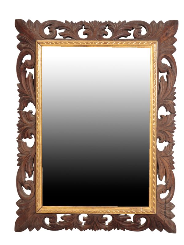 A CARVED AND PARCEL GILT OAK FRAMED MIRROR, IN BOLOGNESE BAROQUE STYLE,