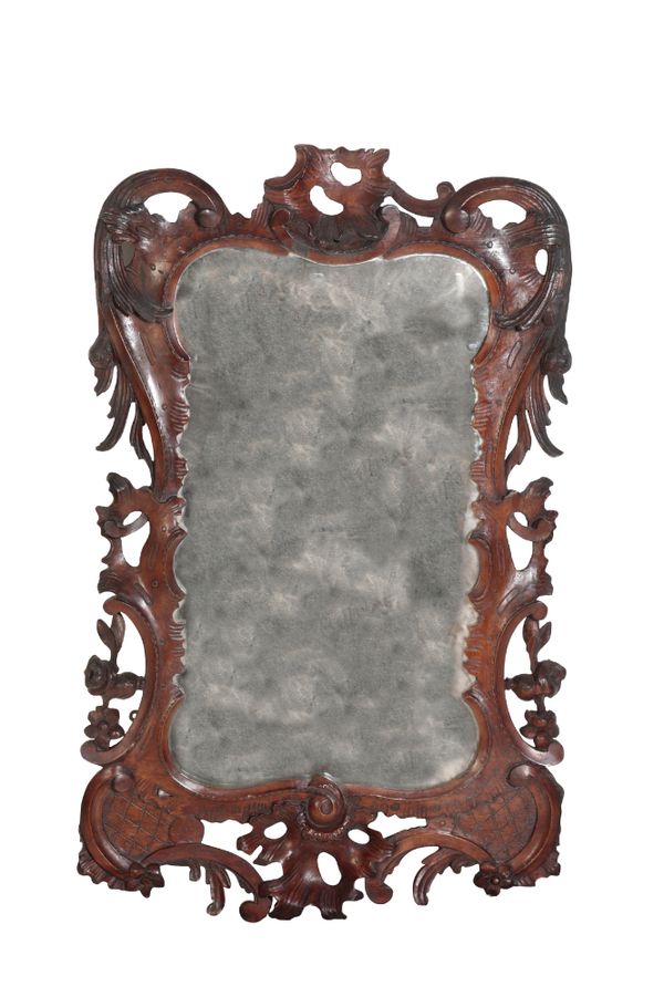 A LATE GEORGE II CARVED WALNUT FRAMED WALL MIRROR, IN ROCOCO STYLE,