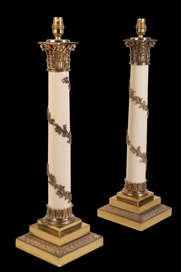 A PAIR OF GILT METAL MOUNTED COLUMN TABLE LAMPS,