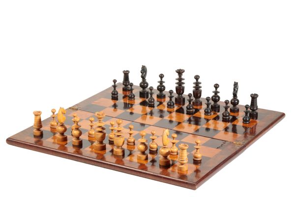 A FRENCH TURNED AND CARVED BOXWOOD AND EBONISED CHESS SET IN REGENCE STYLE,