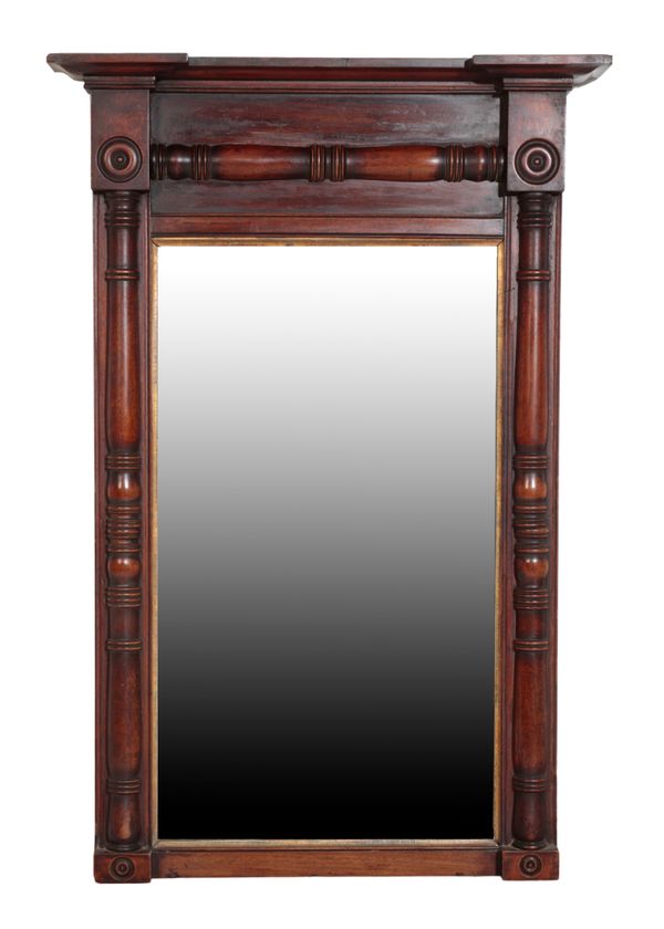 A REGENCY CARVED AND STAINED WALNUT FRAMED PIER MIRROR,