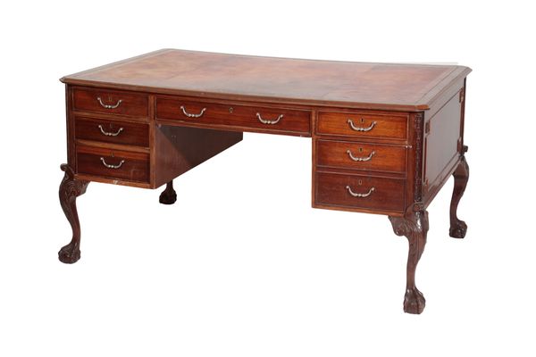 A LEATHER INSET MAHOGANY PARTNERS' DESK, IN GEORGE II TASTE,