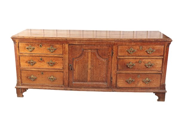 AN EARLY GEORGE III OAK DRESSER,