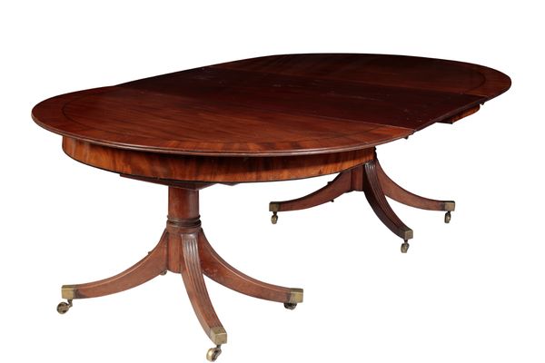 A REGENCY MAHOGANY TWIN PEDESTAL EXTENDING DINING TABLE,