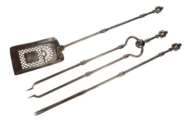 A SET OF REGENCY STEEL FIRE TOOLS,