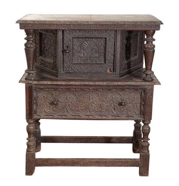 A CARVED OAK COURT CUPBOARD, IN JAMES I STYLE,