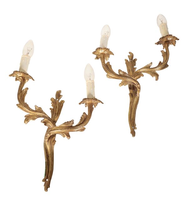 A PAIR OF ROCOCO STYLE GILT METAL WALL SCONCES