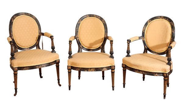 A SET OF THREE CARVED, PAINTED AND PARCEL GILTWOOD CHAIRS, IN GEORGE III STYLE,