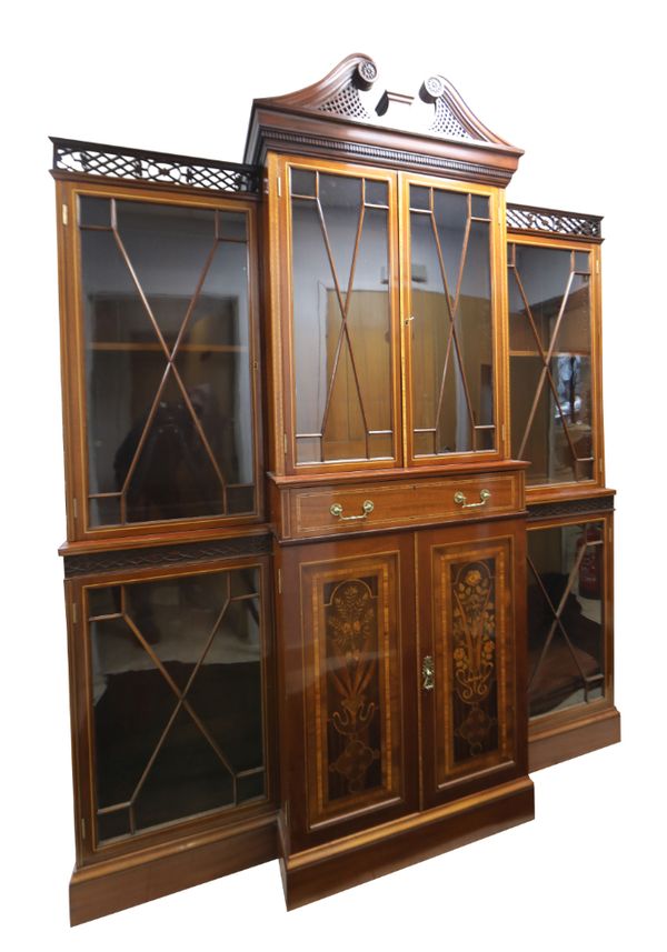 AN EDWARDIAN MAHOGANY, MARQUETRY AND GLAZED BREAKFRONT BOOKCASE, IN CHIPPENDALE TASTE,