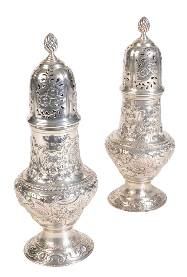 A PAIR OF LATE VICTORIAN SILVER SUGAR CASTERS,