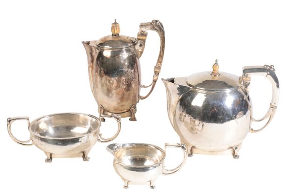 AN ARTS AND CRAFTS FOUR-PIECE SILVER TEA SET,