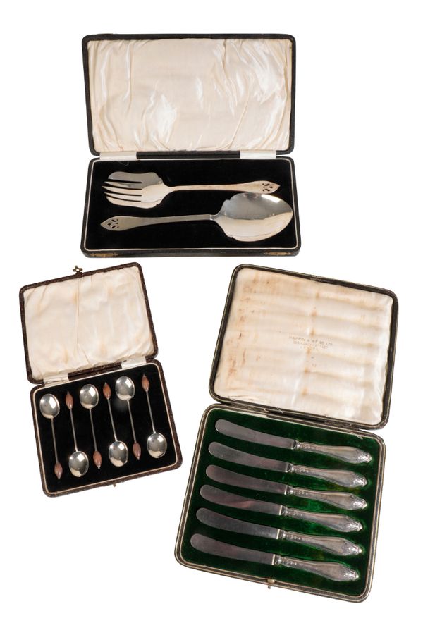 A SET OF CASED SILVER FISH SERVERS,