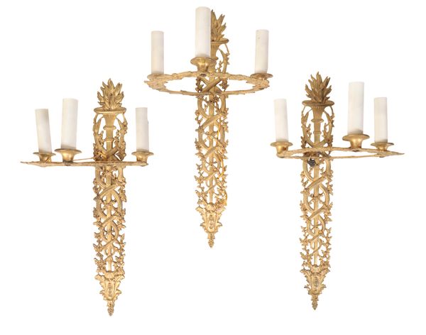 A SET OF SIX EMPIRE STYLE GILT METAL WALL LIGHTS