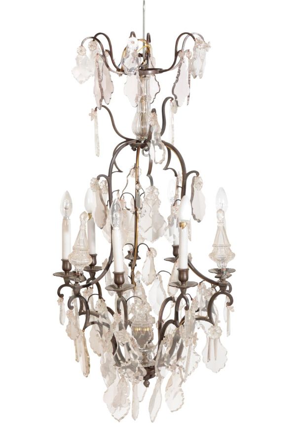 A PATINATED METAL AND GLASS HUNG SIX LIGHT CHANDELIER, IN LOUIS XV TASTE,