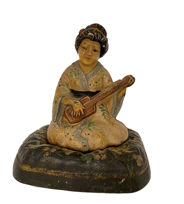 A HUBLEY CAST IRON DOORSTOP IN THE FORM OF A GEISHA