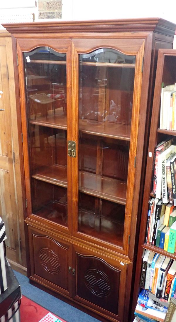 A CHINESE HARDWOOD GLAZED DISPLAY CABINET