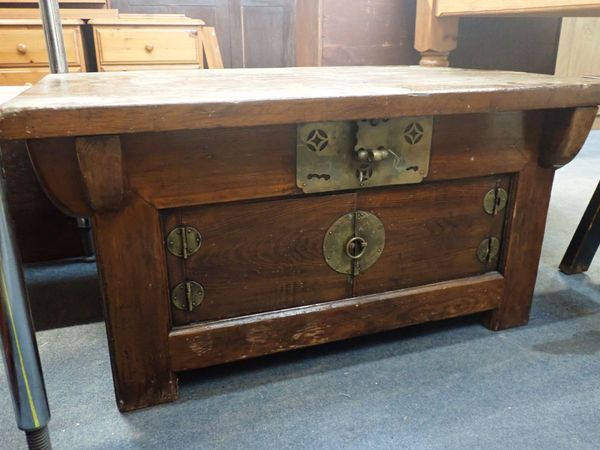 A CHINESE STAINED PINE LOW CABINET