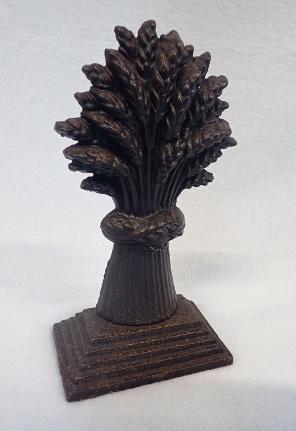 A 19TH CENTURY CAST IRON DOOR STOP
