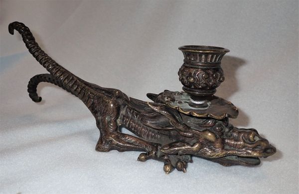 BRONZE CHAMBER STICK IN THE FORM OF A MYTHICAL BEAST