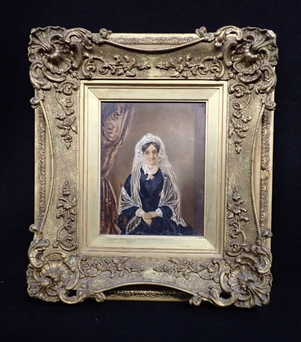 A 19TH CENTURY PORTRAIT OF A LADY IN A LACE BONNET AND SHAWL