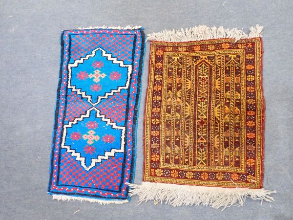 A SMALL BROWN AND GOLD PERSIAN RUG