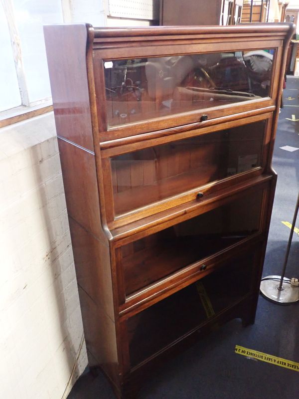 AN EARLY 20TH CENTURY MAHOGANY BOOKCASE BY KENRICK & JEFFERSON