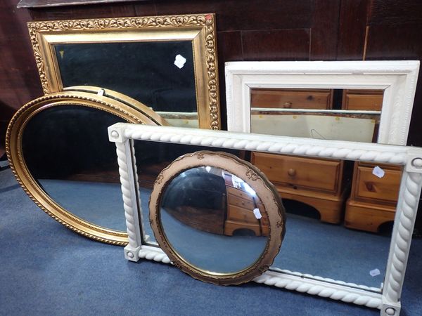 A GILT FRAMED MIRROR WITH BEVELLED PLATE