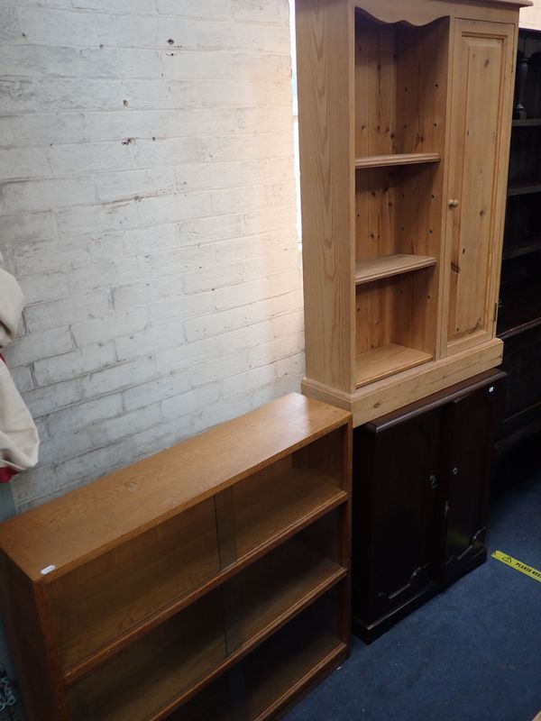 A MID-CENTURY MODERN PALE OAK BOOKCASE WITH SLIDING GLASS DOORS