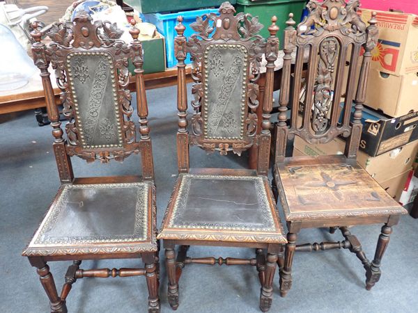 A PAIR OF VICTORIAN CARVED OAK SIDE CHAIRS