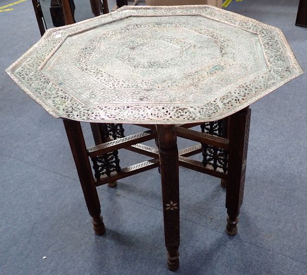 A FOLDING PERSIAN TABLE, WITH PIERCED COPPER TOP