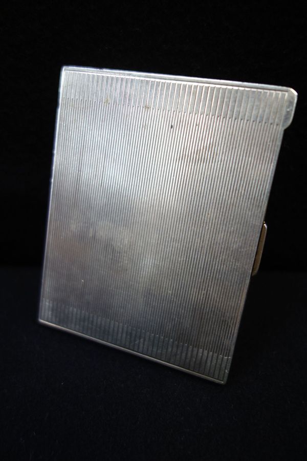 A SILVER CIGARETTE CASE