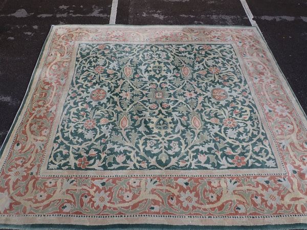 A LARGE PERSIAN DESIGN CARPET